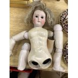 An early 20th century Lanternier & Cie, Limoges France bisque head doll, Cherie no. 11 and a another