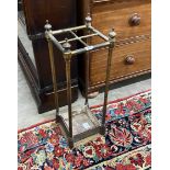 A late Victorian cast iron and brass four division stick stand, height 63cm