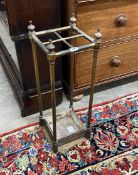 A late Victorian cast iron and brass four division stick stand, height 63cm