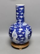 A Chinese blue and white figural vase on hardwood stand, 40cm total height