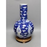 A Chinese blue and white figural vase on hardwood stand, 40cm total height