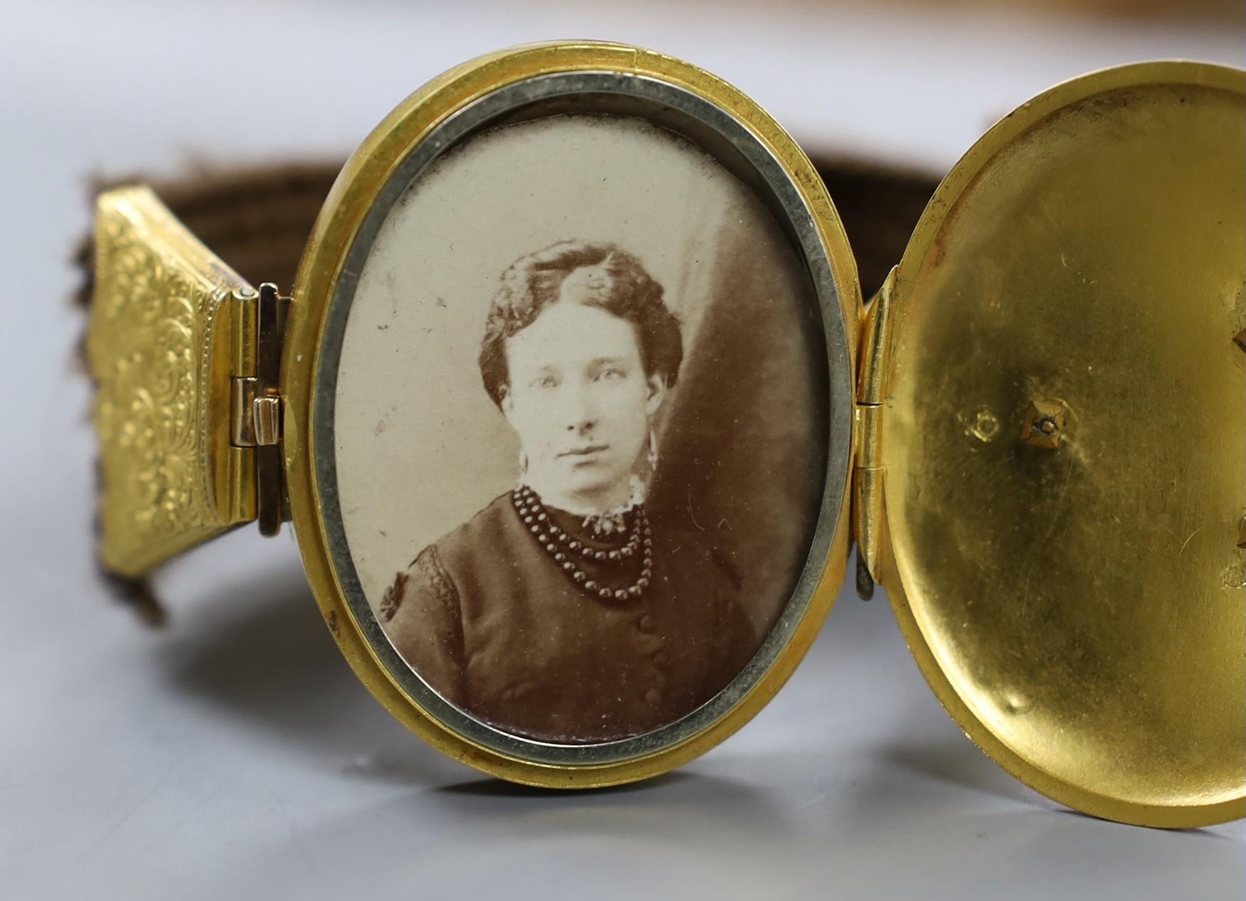 A Victorian yellow metal and hairwork bracelet with central photographic locket, central motif 44mm, - Image 3 of 3