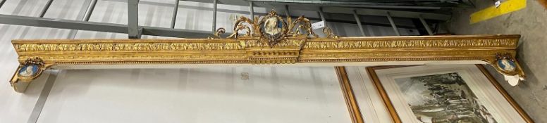 A Victorian carved giltwood and composition pediment with faux jasper panels, length 280cm