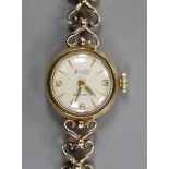 A lady's 9ct gold Accurist manual wind wrist watch, on a 9ct gold bracelet, overall 17.8cm, gross