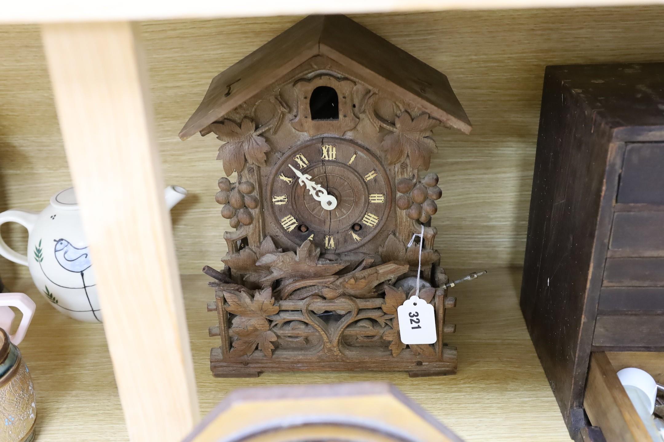 A Black Forest cuckoo clock, together with another octagonal faced timepiece, a Bakelite timepiece - Image 5 of 5