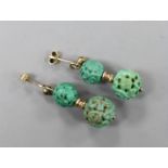 A pair of Chinese yellow metal and two turquoise bead set earrings, both carved with Shou