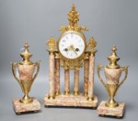 A French gilt metal and marble clock garniture, 38cm