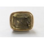 A 19th century yellow metal overlaid and citrine? set intaglio fob seal, the matrix carved with