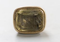 A 19th century yellow metal overlaid and citrine? set intaglio fob seal, the matrix carved with