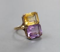 A mid 20th century 9ct gold, amethyst and citrine set two stone dress ring, size N, gross