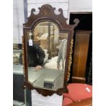 An early 20th century George III style parcel gilt fret cut mahogany mirror (a.f.), width 60cm,
