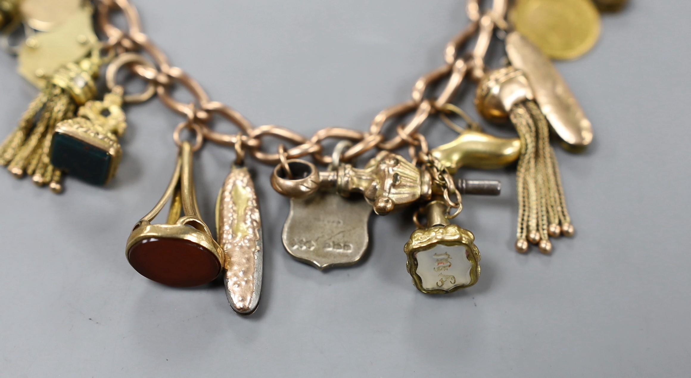 A 9ct charm bracelet, hung with assorted charms including two 9ct, silver and enamel, gilt metal and - Image 2 of 4