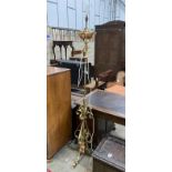 An Art Nouveau brass and copper telescopic oil standard lamp converted to electricity