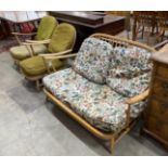 An Ercol light beech three piece lounge suite, settee length 134cm, width 75cm, height 75cm