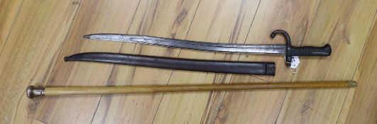 A silver mounted malacca walking cane together with a 19th century French bayonet