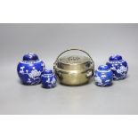 A Chinese bronze hand warmer and four Chinese blue and white Prunus jars and covers. Tallest 12cm