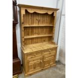 A Victorian style pine kitchen dresser, width 117cm, depth 43cm, height 194cm