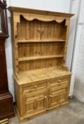 A Victorian style pine kitchen dresser, width 117cm, depth 43cm, height 194cm