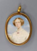 A yellow metal mounted oval portrait miniature of a young lady pendant miniature, the glazed back
