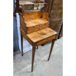 A George III satinwood cheveret or reading table with removeable book carrier, width 48cm, depth