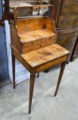 A George III satinwood cheveret or reading table with removeable book carrier, width 48cm, depth