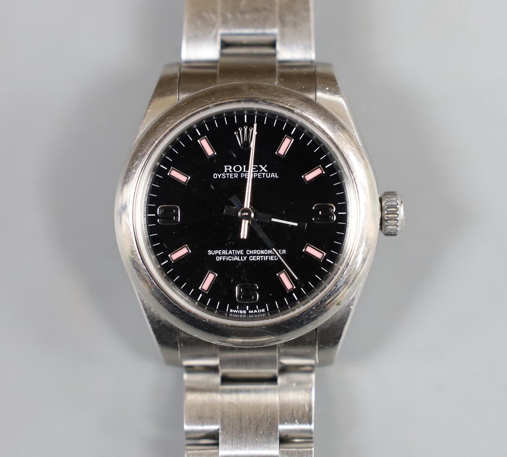 A lady's 2011 stainless steel Rolex Oyster Perpetual wrist watch, on a stainless steel Rolex