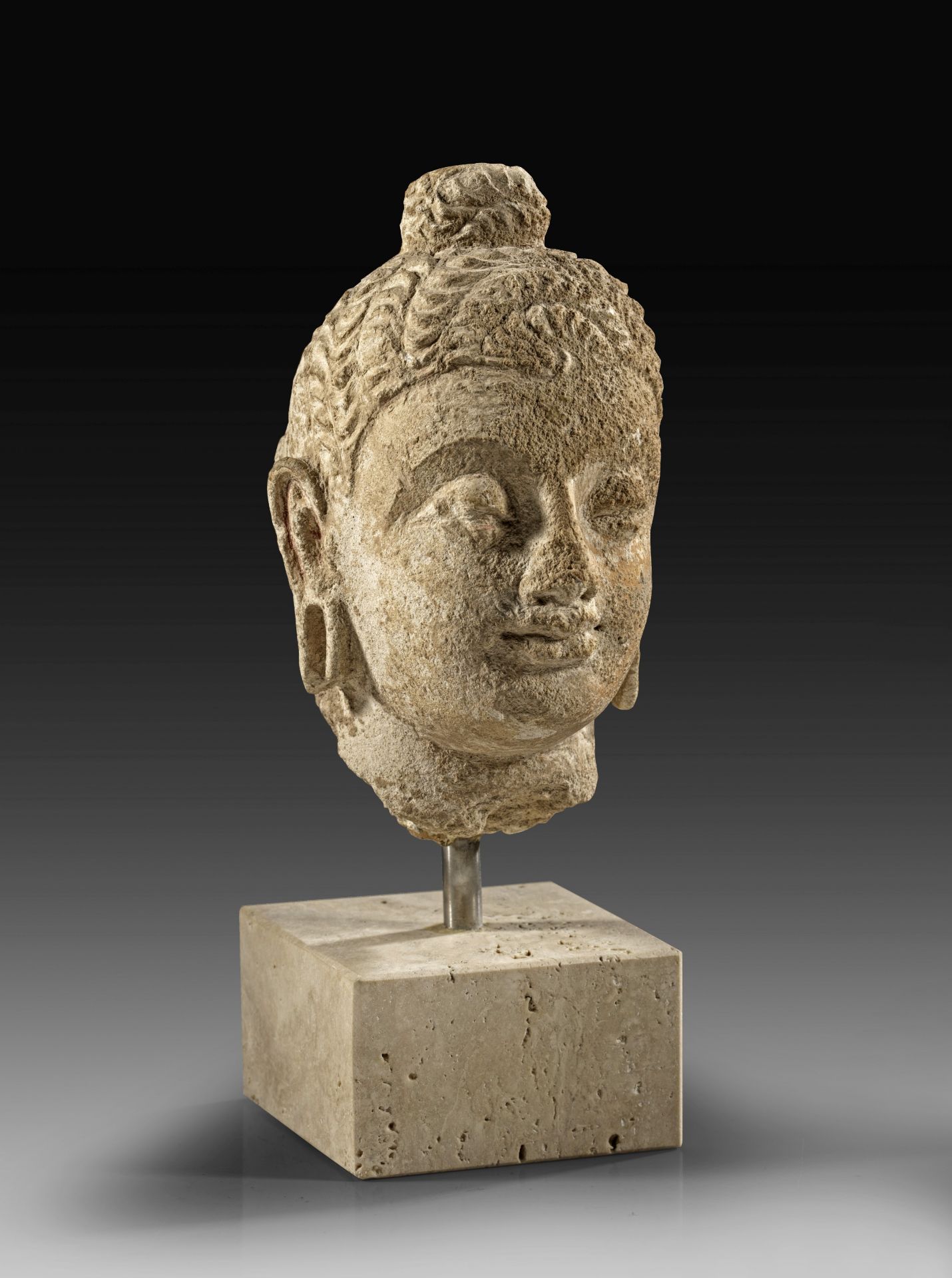 Small Buddha head of stucco.