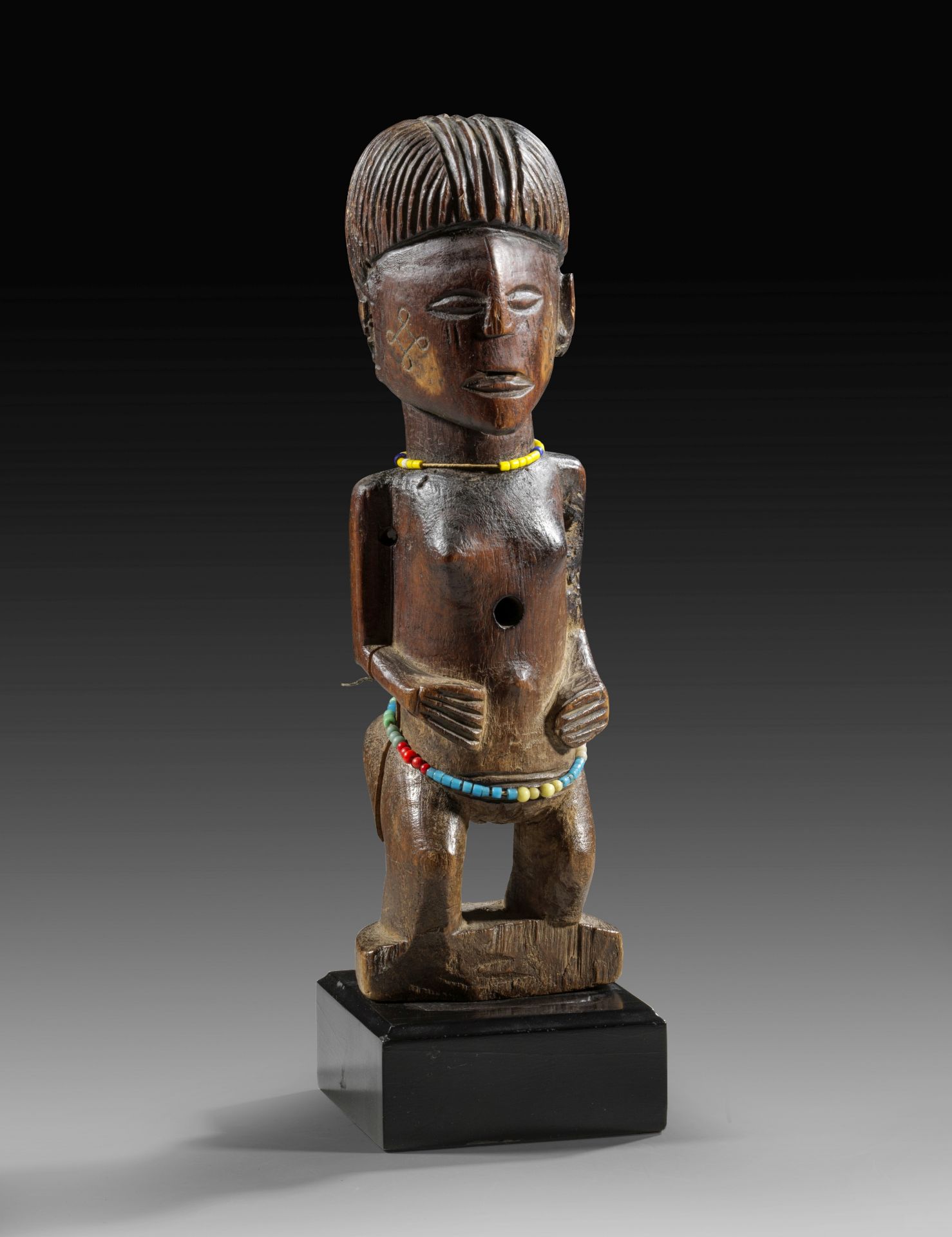 Luena standing female figure from Angola.