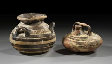 Two Mycenean vases made of reddish terracotta.