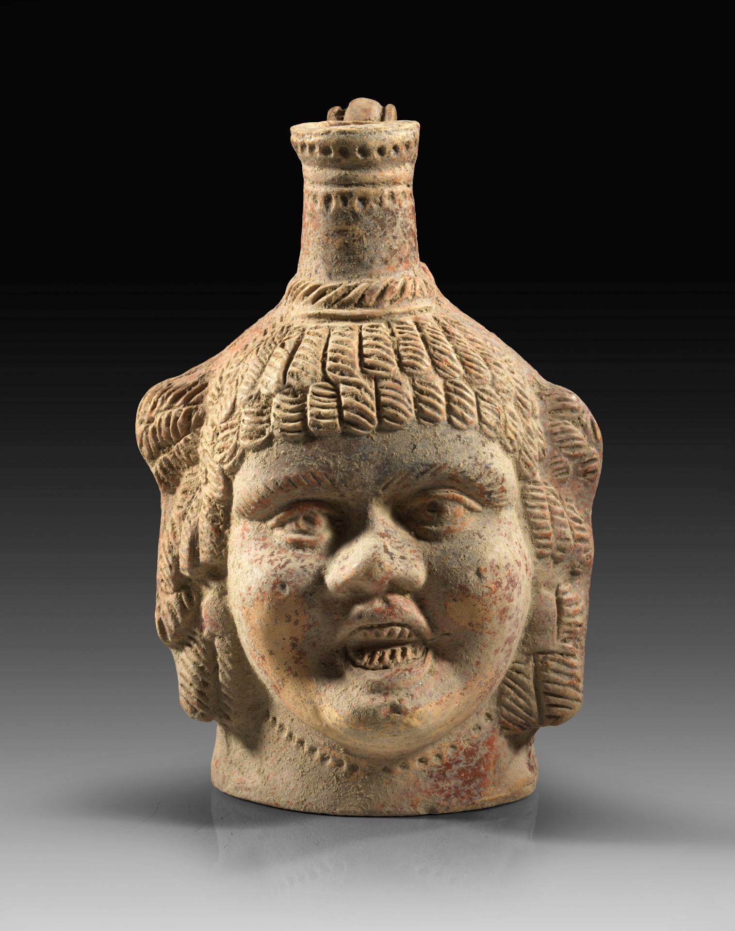 Figural terra sigillata bottle.