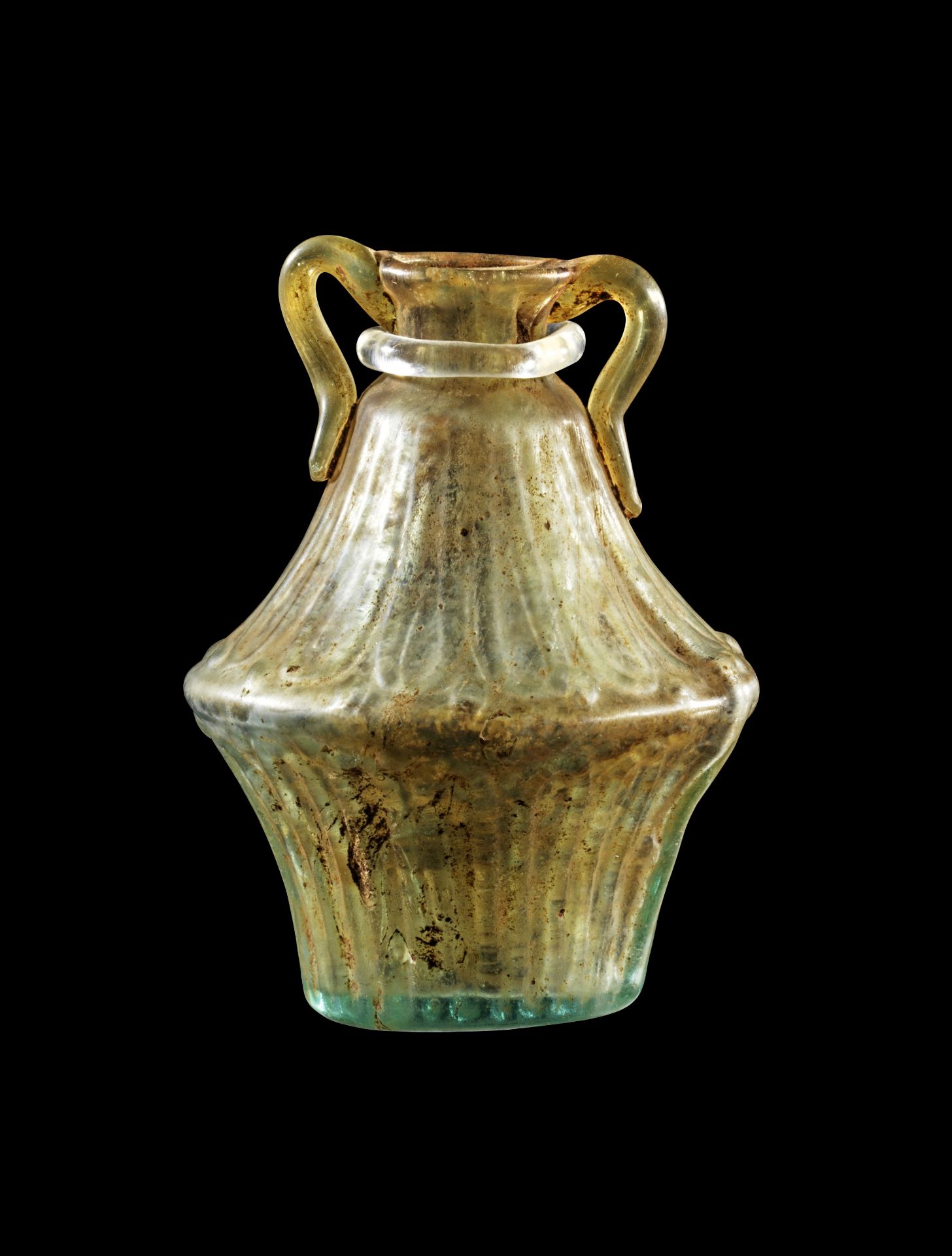 Roman biconical amphoriskos of colorless glass with fine ornament. 