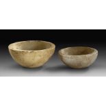 Two bowls with engraved decor.