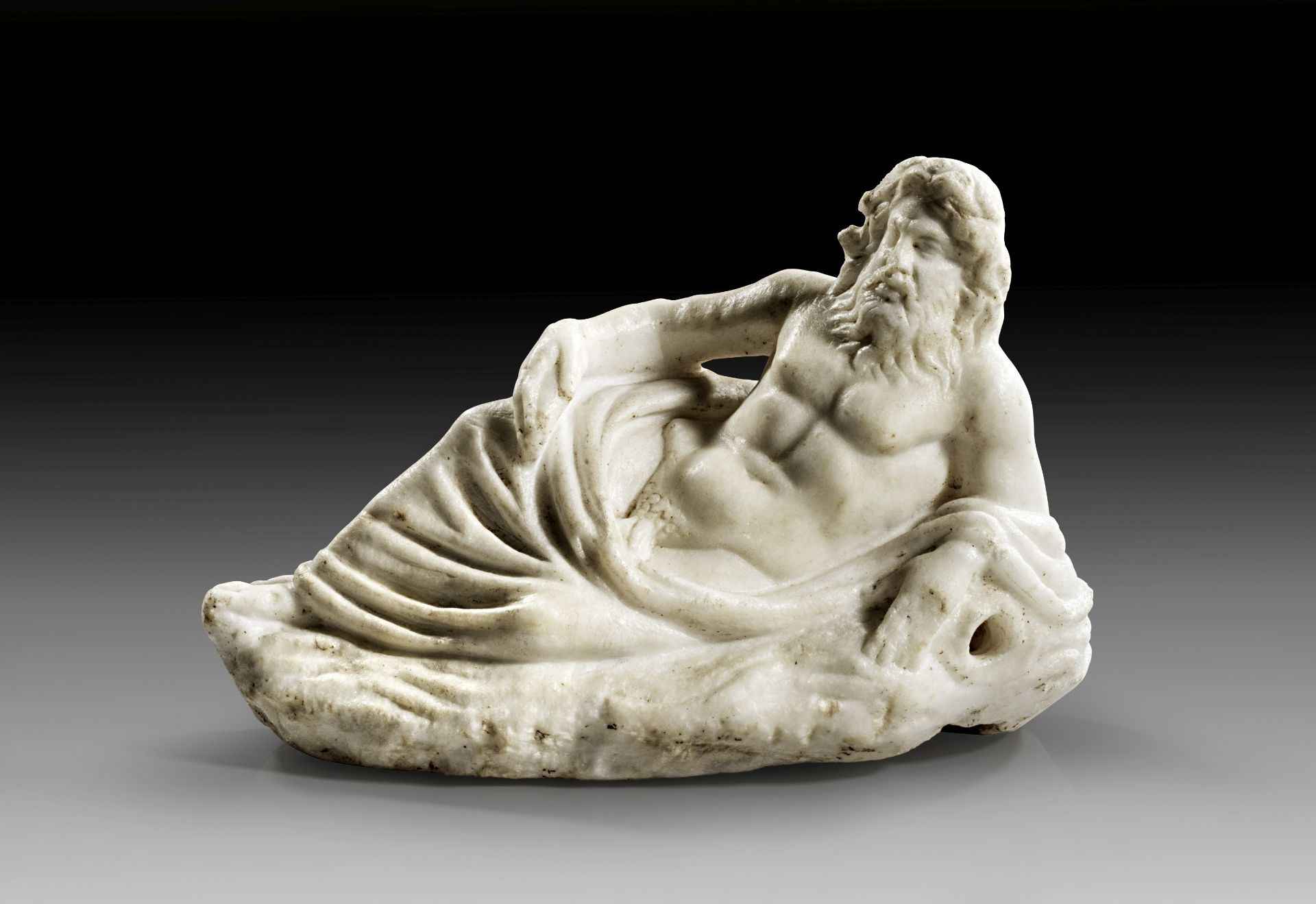 Roman fountain figure of a reclining river god.