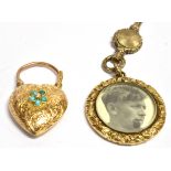 A VICTORIAN YELLOW METAL PHOTO FOB And a yellow metal heart photo padlock. The circular photo fob