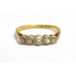 AN 18CT GOLD PLATINUM AND EUROPEAN CUT DIAMOND FIVE STONE RING the shank marked 18ct, ring size O,