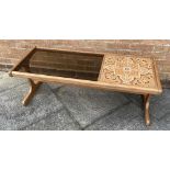 A G-PLAN STYLE TEAK COFFEE TABLE the rectangular top with tiles and glass inset, 121cm x 50cm,