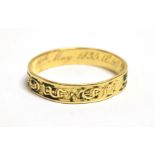 A WILLIAM IV 18CT GOLD MEMORIAL RING The ring with all round lettering and worn black enamel,