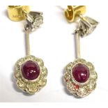 A PAIR OF 18CT WHITE GOLD RUBY AND DIAMOND PENDENT FLOWER HEAD EARRINGS earring length excluding