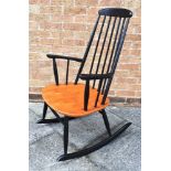 ILMARI TAPIOVAARA FOR ASKO, FINLAND: a beech and ebonised stickback rocking chair, the seat 56cm