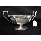 A WILLIAM IV SILVER TWO HANDLED BOWL Of curved angular shape on a curved angular pedestal, the