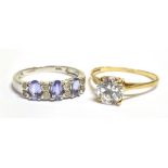 A 14KT WHITE GOLD DRESS RING and a 9ct gold cocktail ring, the white gold ring set with alternate