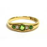 AN EARLY 20TH CENTURY 18CT GOLD DIAMOND AND GREEN STONE BOAT RING the shank marked London 18ct,