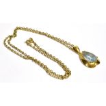 AN 18CT GOLD AQUAMARINE PENDANT with a 9ct gold chain, the pear cut aquamarine measuring 1.6cm