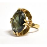 A 9CT GOLD BROWN GREEN TOURMALINE COCKTAIL RING The faceted oval Tourmaline measuring 1.8 cm by 1.