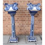 A PAIR OF VICTORIAN CERAMIC JARDINIERES ON STANDS, the jardinieres 36cm square, 128cm high overall
