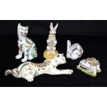 FIVE FRENCH FAIENCE ANIMALS: a seated cat with glass inset eyes, another cat figure, a frog and