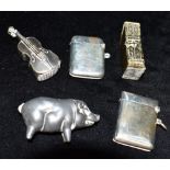 A COLLECTION OF VESTAS AND NOVELTY LIGHTER BOXES comprising two silver vestas, a white metal vesta/