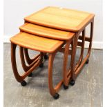 A NEST OF THREE NATHAN TEAK COFFEE TABLES on casters, the largest 48cm x 52cm, 56cm high Condition