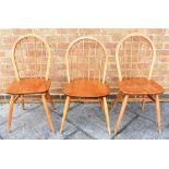 A PAIR OF LIGHT ERCOL STICKBACK DINING CHAIRS together with another similar (3) Condition Report :