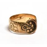 A GEORGE V ROSE GOLD BUCKLE AND BELT RING The ring with all around floral pattern, hallmarked for